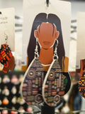 African woman wooden earrings tribal pattern