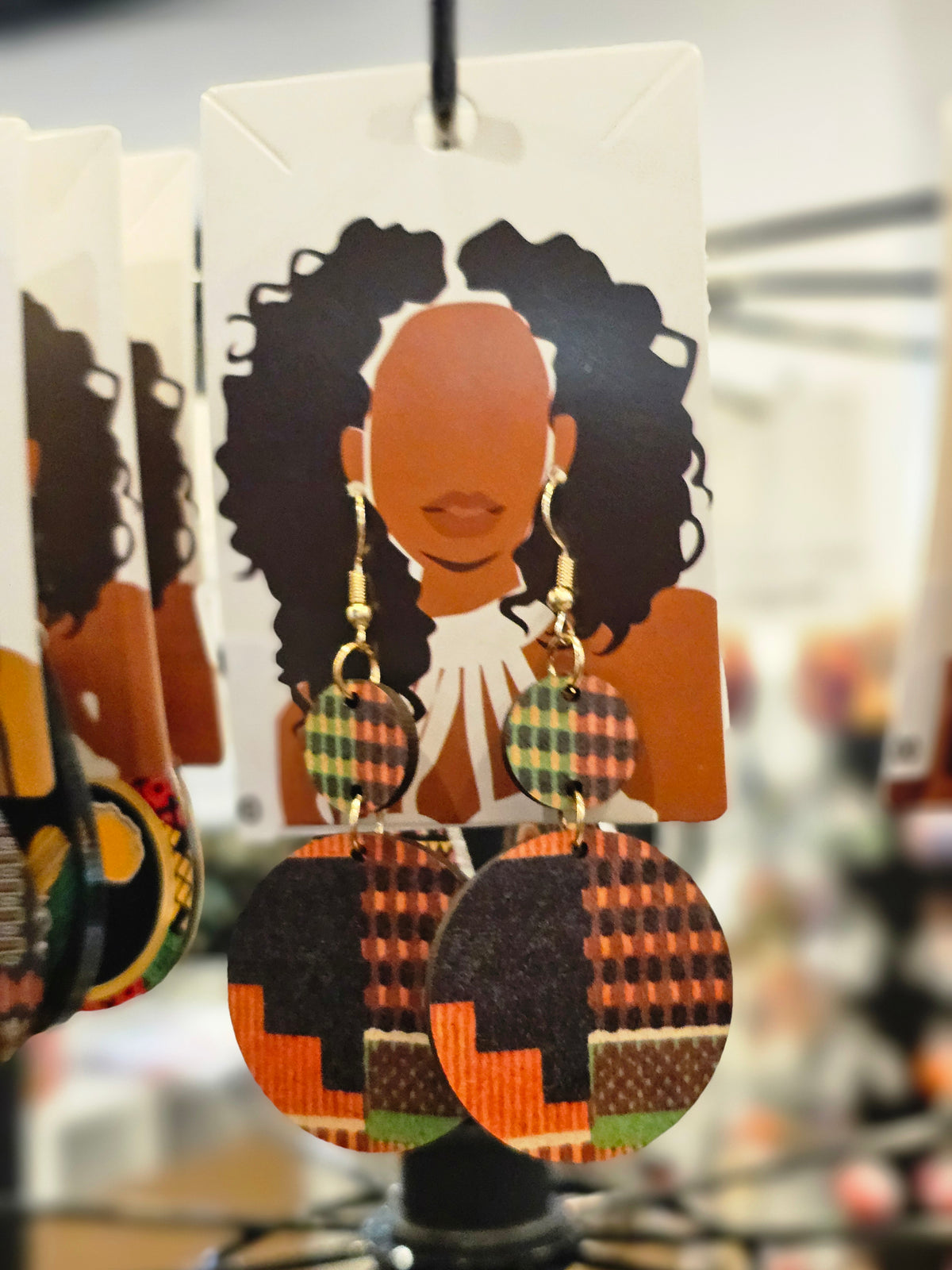 African woman wooden earrings tribal pattern