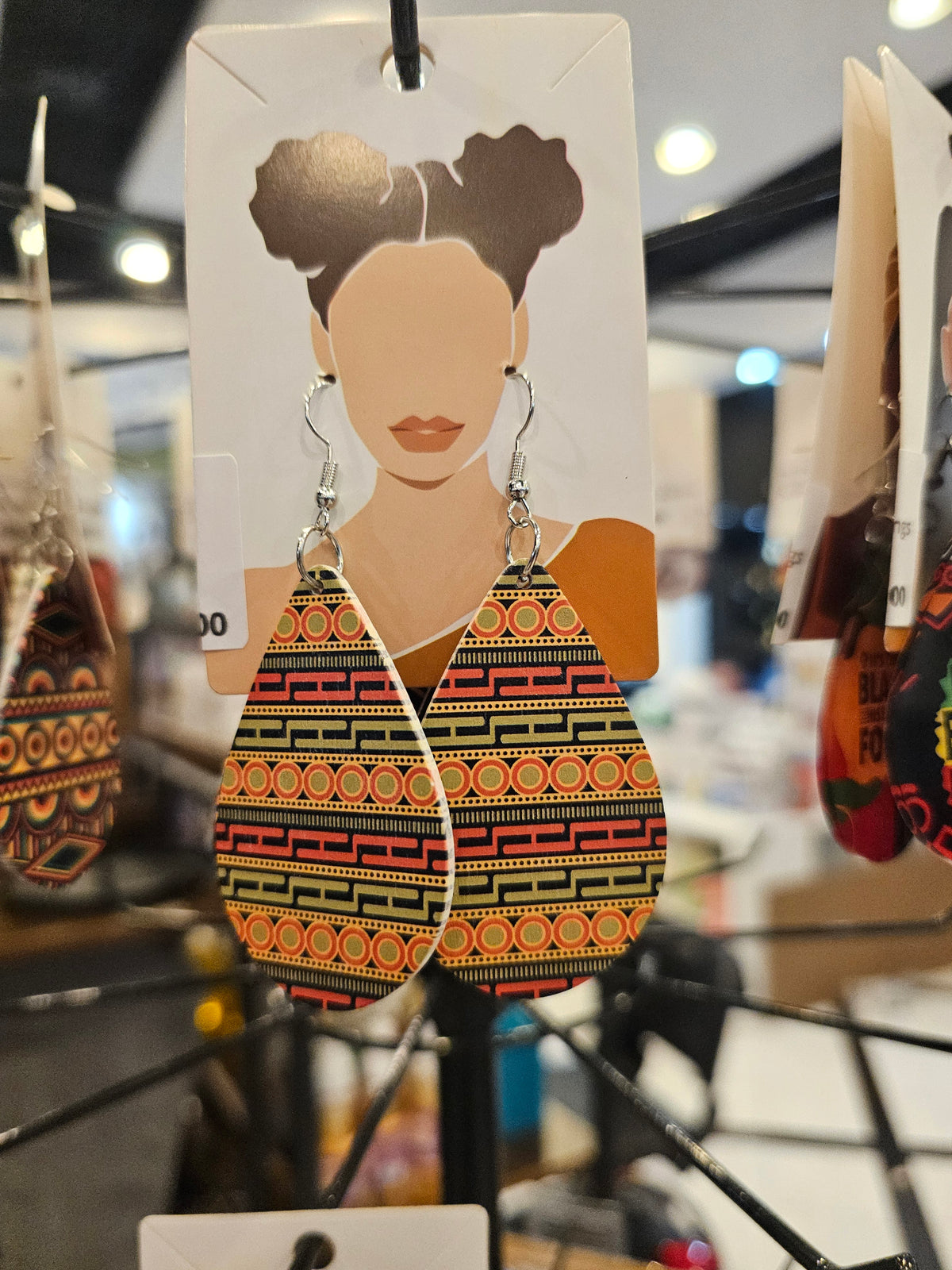 African woman wooden earrings tribal pattern