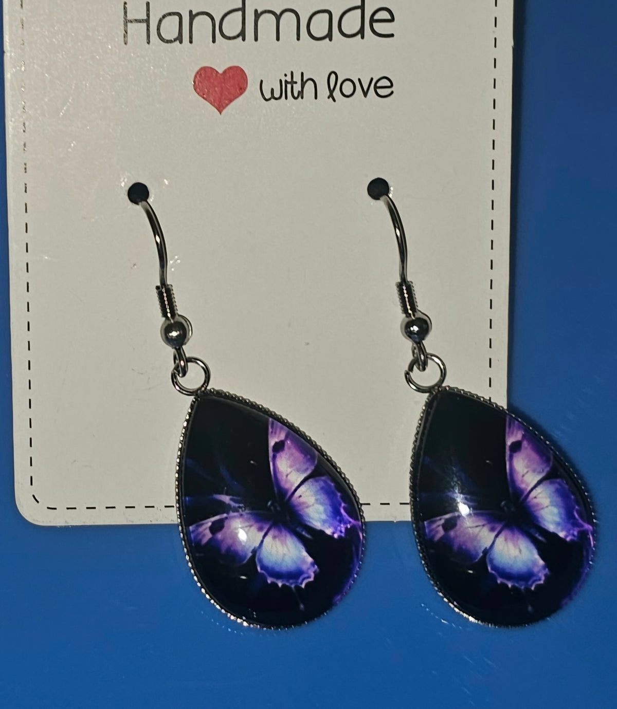 Purple butterfly tear drop shaped earring