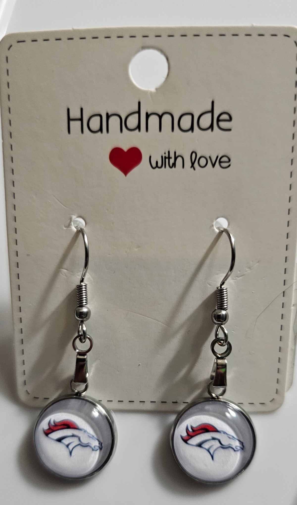 Broncos earrings white background